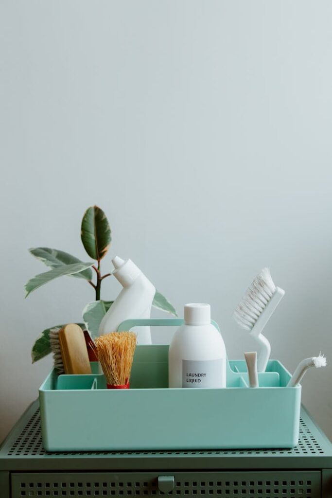 The Art of Drawing Readers In: Your attractive post title goes here Minimalist display of eco-friendly cleaning products in pastel organizer, highlighting sustainable living.